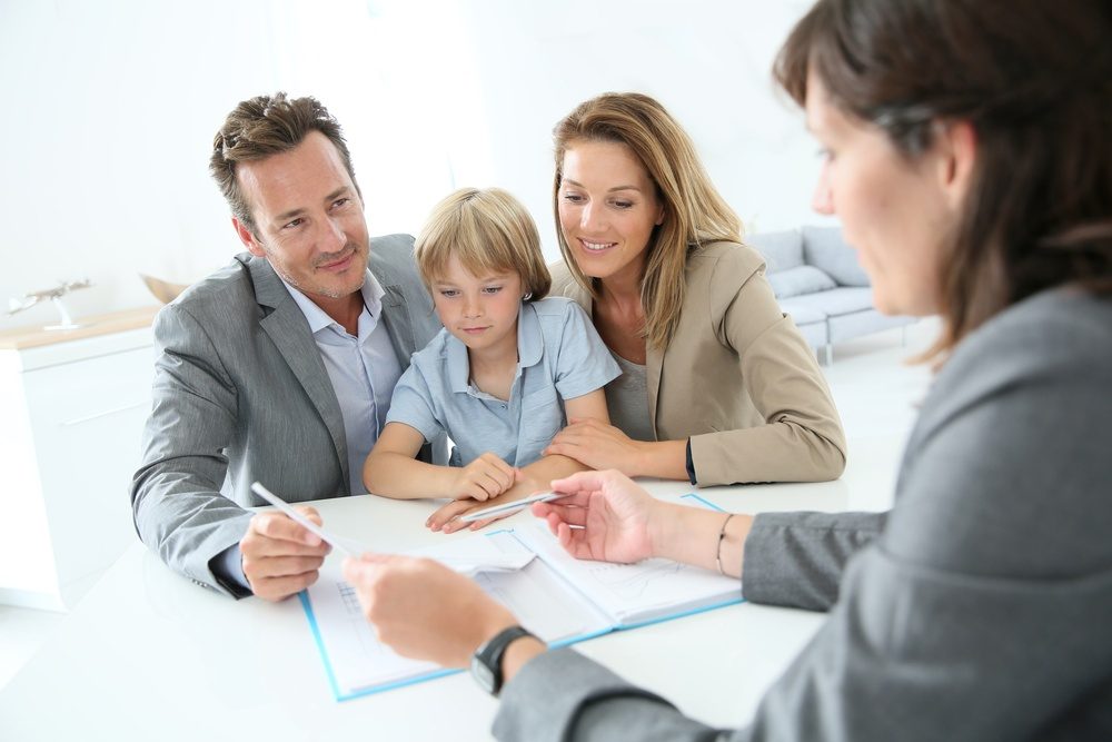 Family meeting real-estate agent to buy new home.jpeg